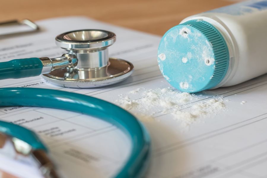 Talc powder next to a doctor's stethoscope